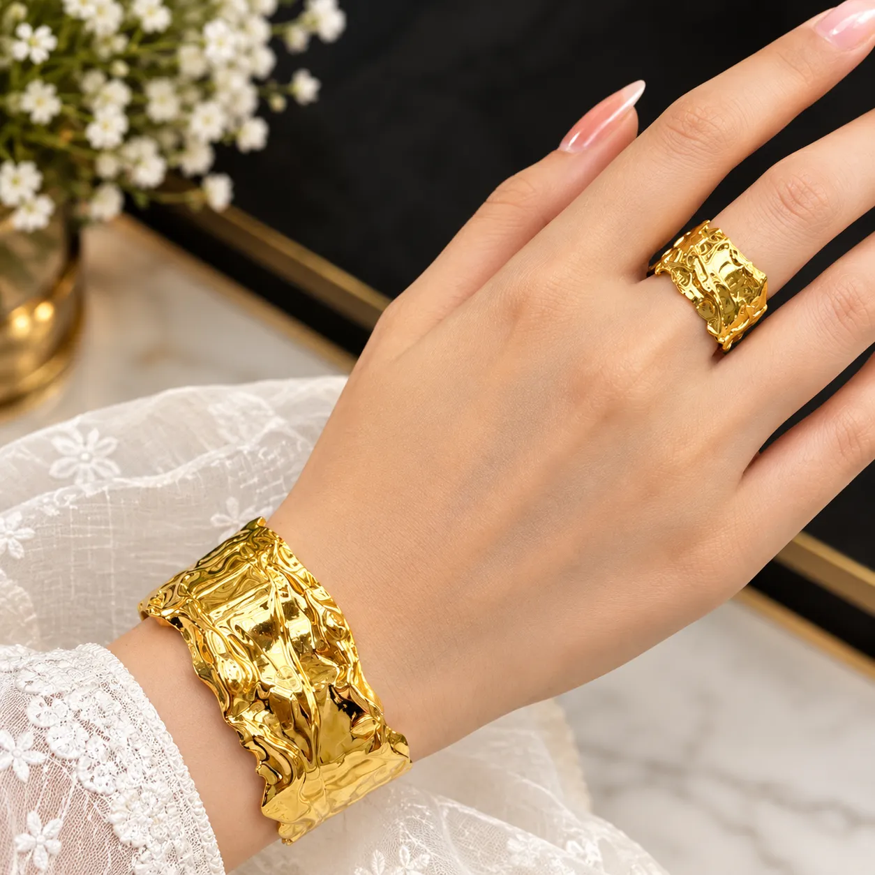 A glossy, golden, crumpled-texture jewellery set to bring out a regal elegance in your look!
